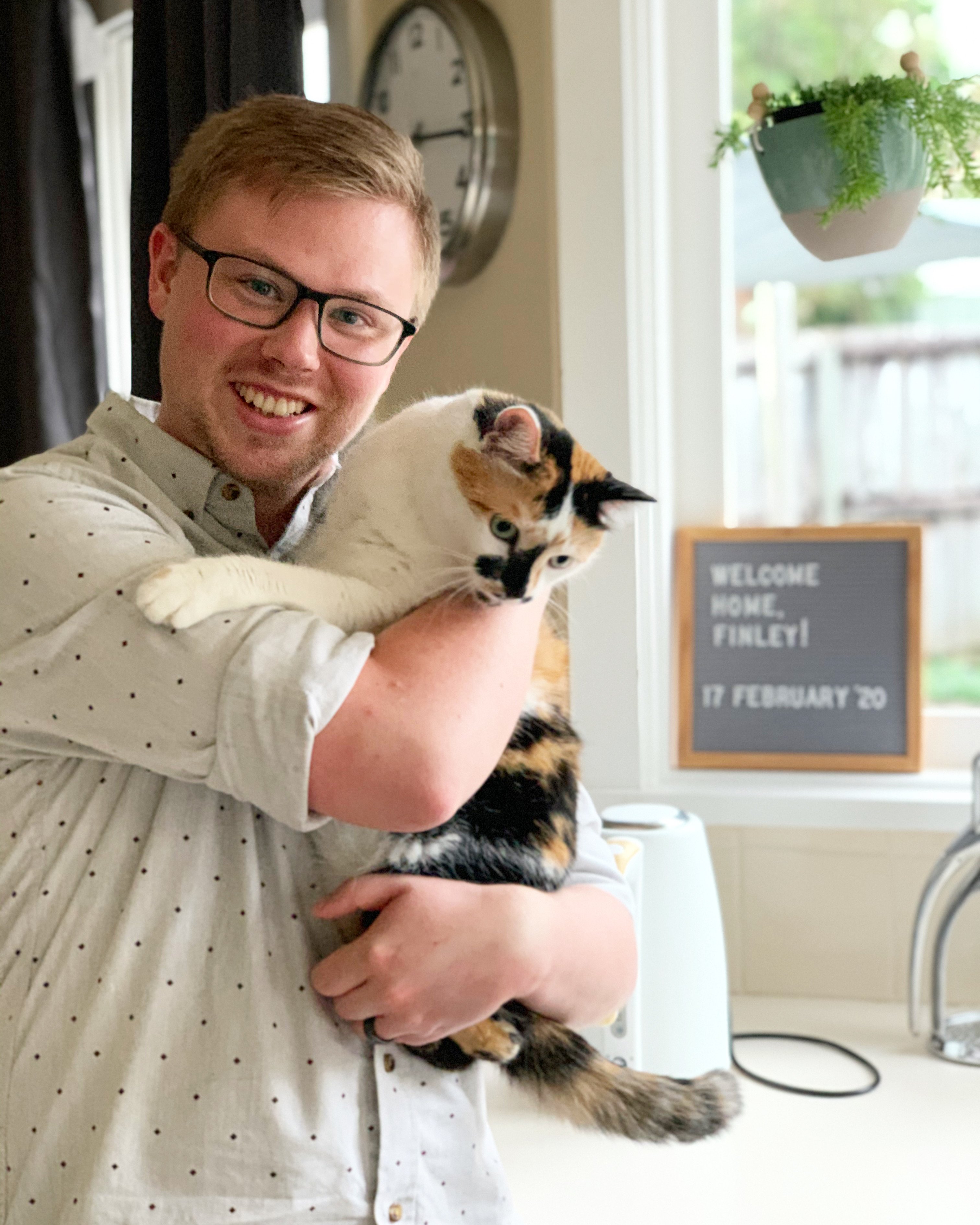 Finley the cat moved to Australia pictured with her dad after quarantine